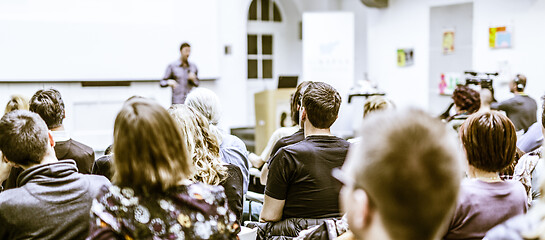 Image showing Man giving presentation in lecture hall at university.