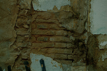 Image showing Exposed brickwork on an old damaged wall