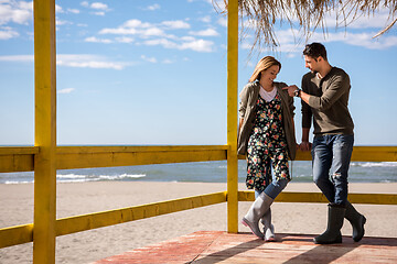 Image showing Couple chating and having fun at beach bar