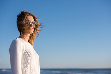 Image showing Young woman enjoying the warm autumn day