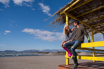 Image showing young couple drinking beer together at the beach