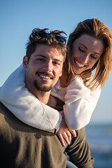 Image showing couple having fun at beach during autumn