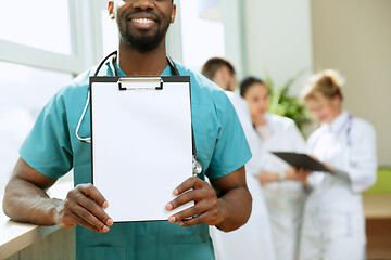 Image showing Beautiful smiling african doctor over hospital background