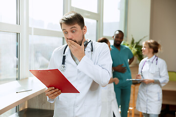 Image showing Beautiful surprised doctor over hospital background