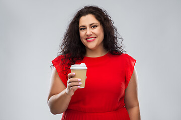 Image showing woman in red dress holding takeaway coffee cup