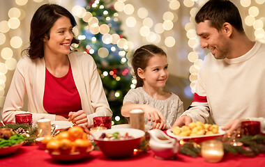 Image showing happy family having christmas dinner at home