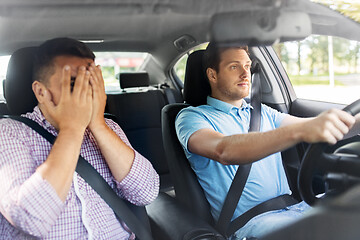 Image showing car driving school instructor and male driver