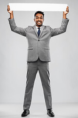 Image showing happy indian businessman with white banner