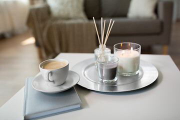 Image showing coffee, candles and aroma reed diffuser on table