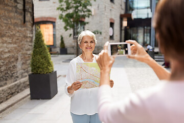 Image showing senior women with city map on street in tallinn