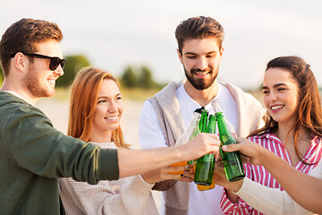 Image showing friends toasting non alcoholic drinks on beach