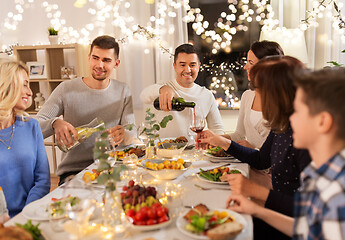 Image showing happy family having dinner party at home