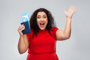 Image showing happy woman with passport and air ticket