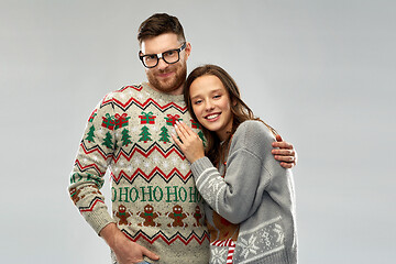 Image showing happy couple at christmas ugly sweater party