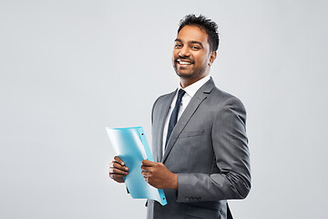 Image showing indian businessman with folder over grey