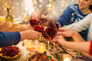 Image showing close up of friends with wine celebrate christmas