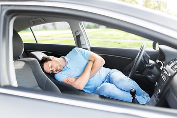 Image showing tired man or driver sleeping in car