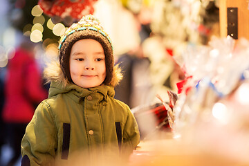 Image showing happy little boy at christmas market in winter