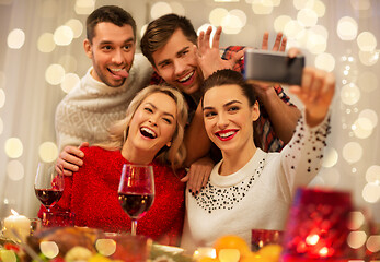 Image showing friends taking selfie at christmas dinner