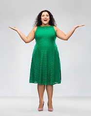 Image showing happy smiling woman in green dress