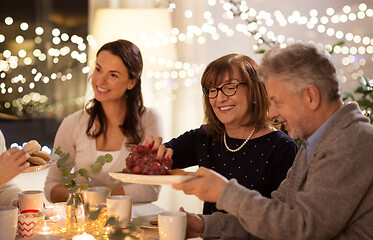 Image showing happy family having tea party at home