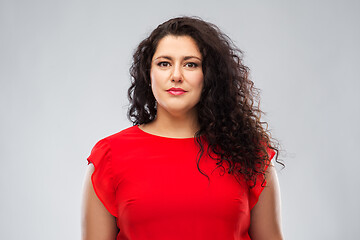 Image showing woman in red dress over grey background