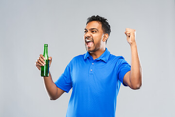 Image showing male fan with beer bottle celebrating victory