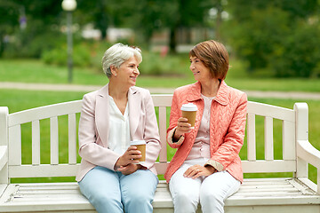 Image showing senior women or friends drinking coffee at park