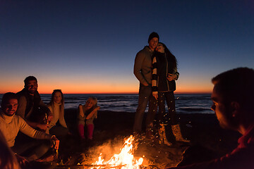 Image showing Friends having fun at beach on autumn day