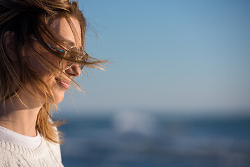 Image showing Young woman enjoying the warm autumn day