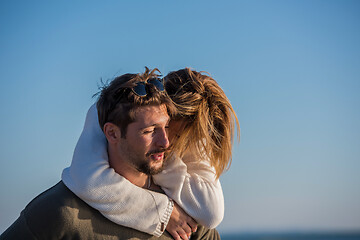 Image showing couple having fun at beach during autumn