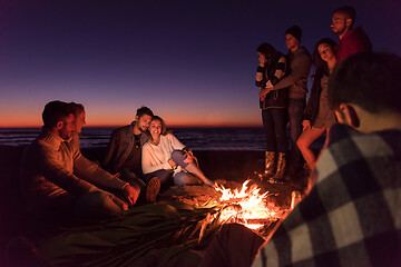 Image showing Friends having fun at beach on autumn day