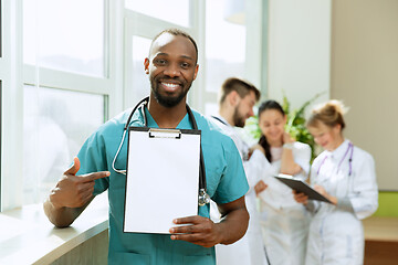 Image showing Beautiful smiling african doctor over hospital background