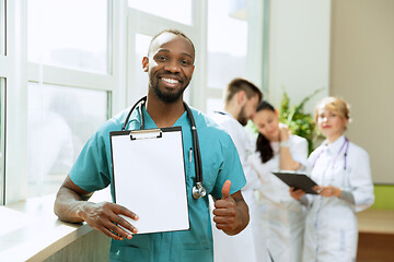 Image showing Beautiful smiling african doctor over hospital background