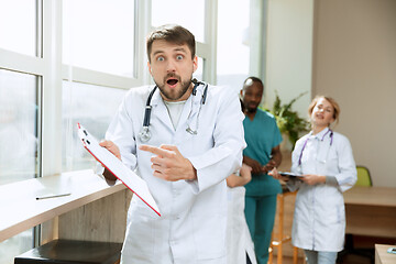 Image showing Beautiful surprised doctor over hospital background