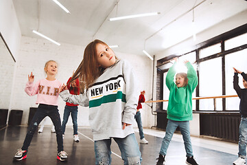 Image showing The kids at dance school. Ballet, hiphop, street, funky and modern dancers