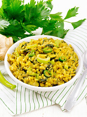 Image showing Kitchari with celery in bowl on white board