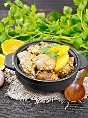 Image showing Liver with oranges in pan on wooden board