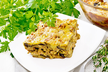 Image showing Casserole of meat and eggplant in plate on light board