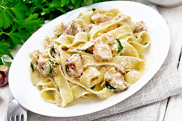 Image showing Pasta with salmon and cream on white board