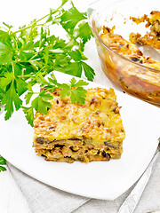 Image showing Casserole of meat and eggplant in plate on napkin