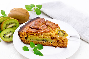 Image showing Pie with kiwi in plate on board