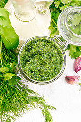 Image showing Sauce of spicy greens in jar on white board top