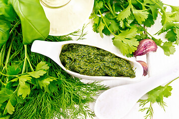 Image showing Sauce of spicy greens in gravy boat on board top