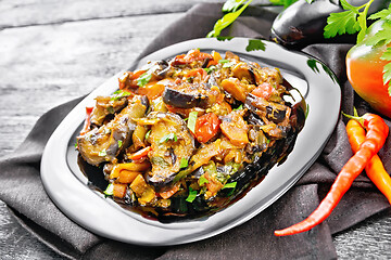 Image showing Ragout with eggplant and pepper on black wooden board