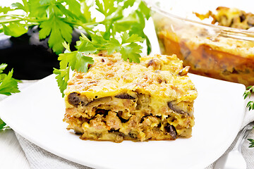 Image showing Casserole of meat and eggplant in plate on wooden board