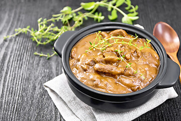 Image showing Goulash of beef in pan on wooden board