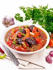 Image showing Ragout vegetable with eggplant on wooden board