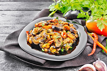 Image showing Ragout with eggplant and pepper on dark board