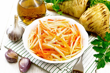 Image showing Salad of parsnip and carrot on napkin